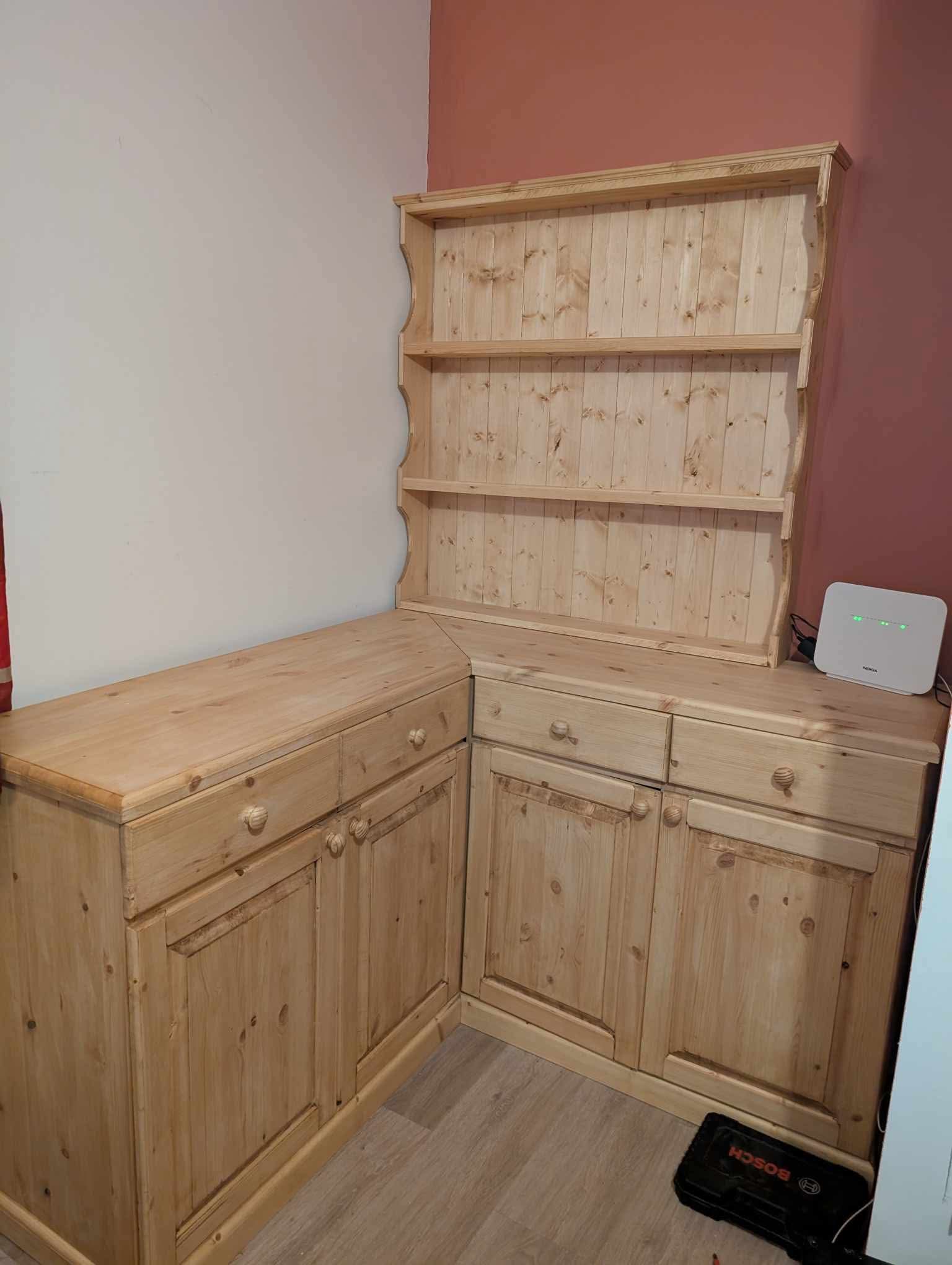 The Torridge Dresser installed in the customer's dining room, tucked into a corner with the plate dresser sat on the right-hand worktop.